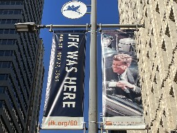 What's With the 'JFK Was Here' Banners in Downtown?