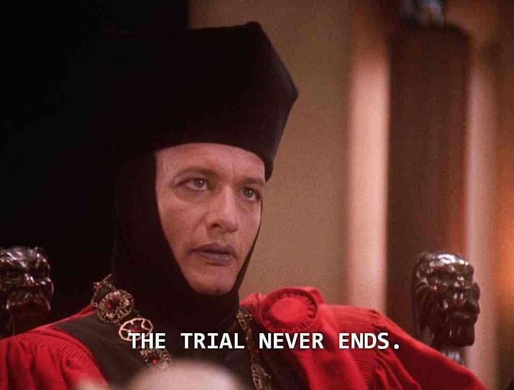 Q from Star Trek the Next Generation with the subtitle "The trial never ends."