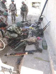 US Marines from Regimental Combat Team 7 meet with Iraqi forces and assess damage in Fallujah, Iraq, 2004 [1000x1333]