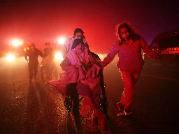 Photos: Strong winds drive wildfires across Los Angeles