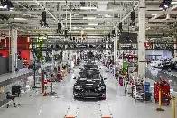 Elon Musk says Tesla workers will be sleeping on the factory floor when new $25,000 EV goes into production next year