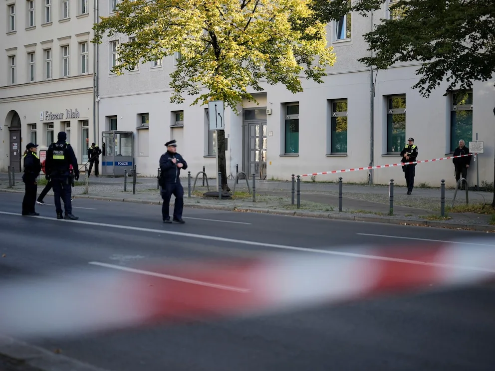 The German chancellor condemns a firebomb attack on a Berlin synagogue and vows protection for Jews