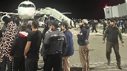 Hundreds storm airport in Russia in antisemitic riot over arrival of plane from Israel