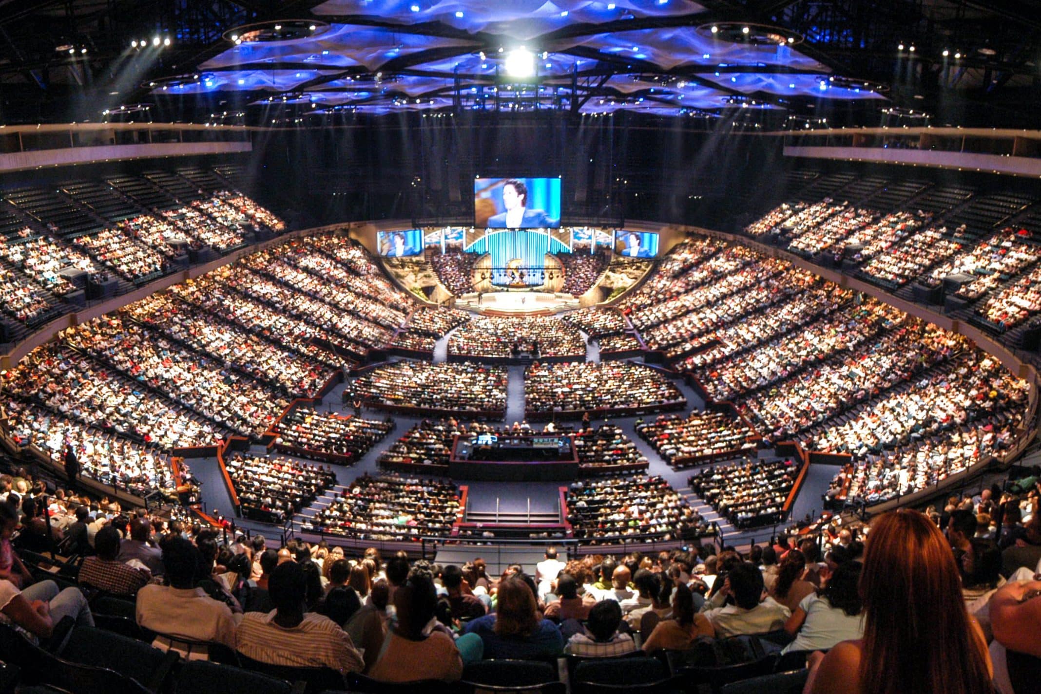 View of the stage from the far end of the sanctuary of Lakewood Church in Houston, Texas - built inside a former basketball stadium.