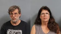 The adoptive parents of 2 children found locked inside a barn in West Virginia are facing felony child neglect charges, authorities say