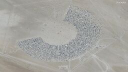 Tens of thousands at Burning Man told to conserve water and food after heavy rains leave attendees unable to leave Nevada desert | CNN