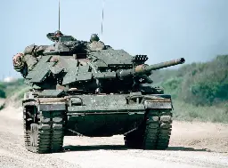 US Marine Corps M60 series tank moves on road during the 1989 Solid Shield exercise [913x673]