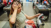 Americans are going into debt to buy groceries. Here's why those balances can be difficult to pay down