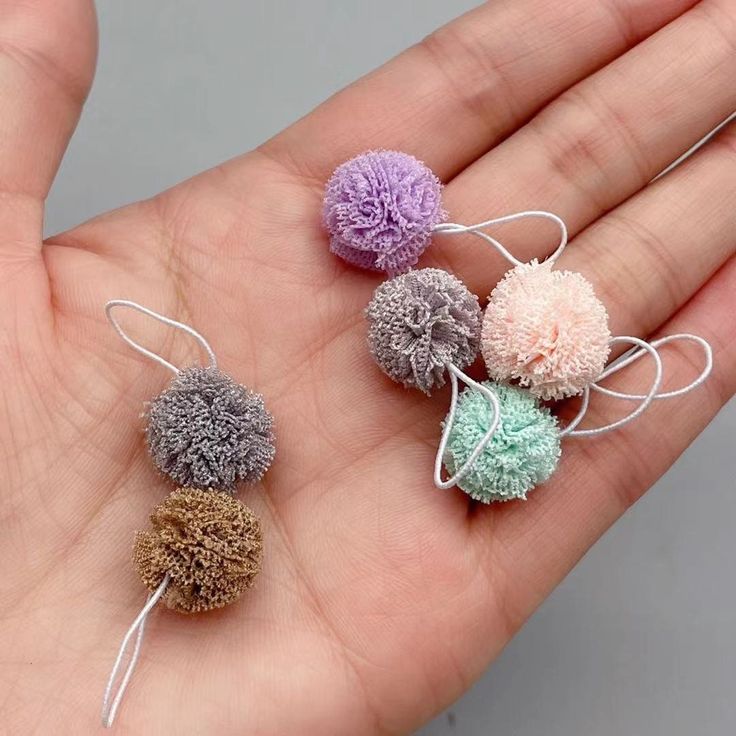 6 bathroom floofy scrubbies in different colors with cords for hanging