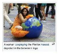 A woman cosplaying the Firefox mascot depicted in the browser's logo