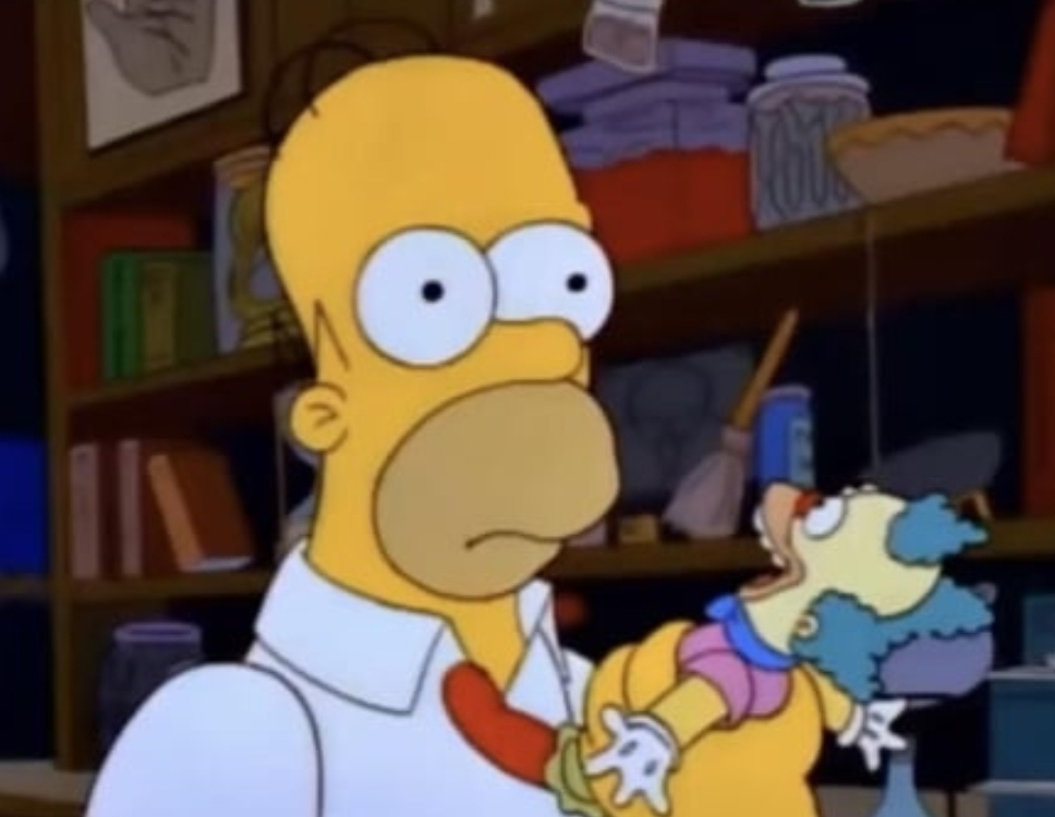 image of Homer Simpson starting forward blankly after hearing &quot;potassium benzoate&quot; and not knowing if it&#39;s good or bad