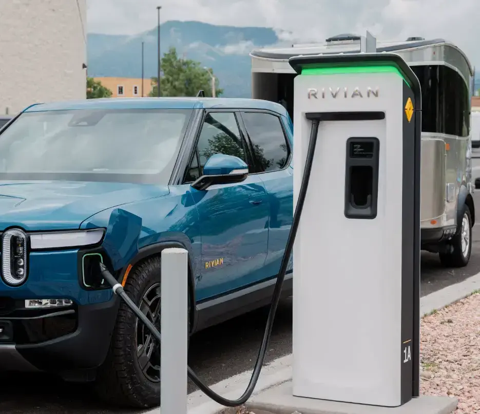 Rivian follows Tesla’s footsteps, will open its charging network to other EVs