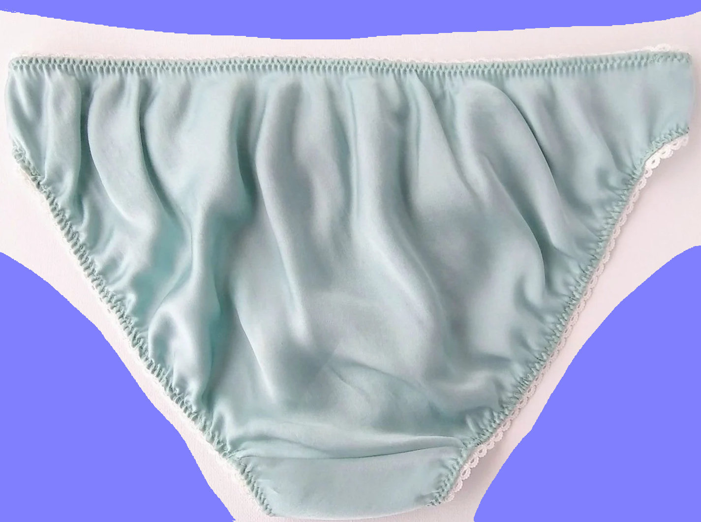 A digitally modified photograph of light blue women's panties on a white backdrop. Purple sections have been crudely added around the outer edges. The image imitates the cropped Matter illustration generated when linking to The Verge article by the thread creator.