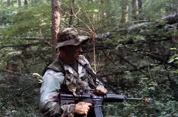 Student at Scout Sniper Instructor school carries M16A2 carbine during training exercise [1017x666]