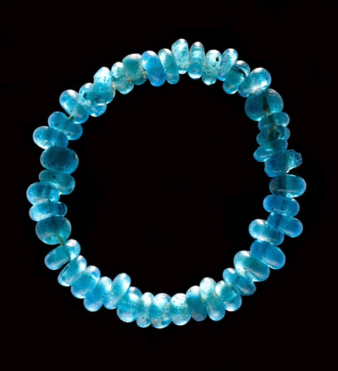 Glass beads found in Denmark, made in Mesopotamia or  Egypt, grave goods buried by ~1200 BCE