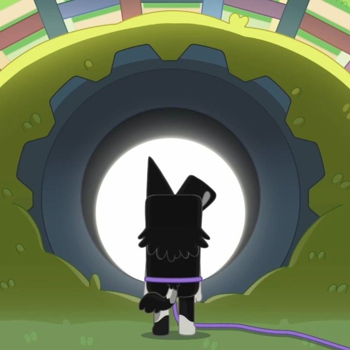 A screen grab from Bluey of the character Mackenzie looking into a drain pipe that is maybe twice his height in diameter. There appears to be a bright glow coming from inside the pipe, making it look as if there is something to behold beyond the pipe.