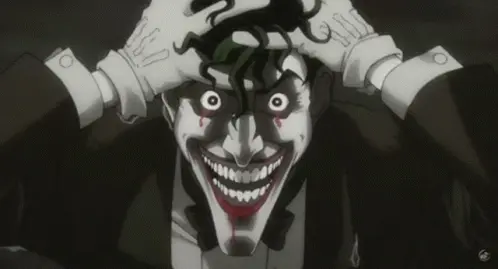 dc comics joker holding his head with crazed open eyes look and laughing animated GIF