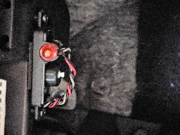 What is this thing? Flashing red light with a button in my car. I pressed the button and the red light stopped blinking. [SOLVED]