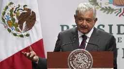 Mexican president defends disclosing a reporter's phone number, saying the law doesn't apply to him