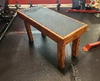 A wood seat made from scraped pallets