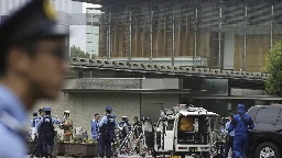 Japan's ruling party headquarters is attacked with firebombs and suspect is arrested, media report