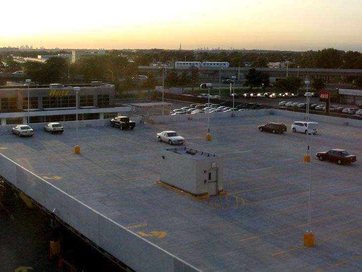 a parking lot in the end of a day in 2000's. unknow author