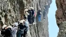 Chinese climbers stuck on cliff for more than an hour due to overcrowding | CNN