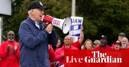 ‘Pro-union’ Biden endorses striking workers’ pay demands in historic visit to UAW picket line in Michigan - live