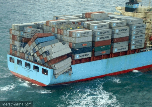 Picture of a container ship, the end stack of containers has toppled over the side of the ship