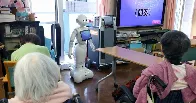 Inside Japan's futuristic care homes where robots look after elderly