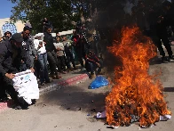 Palestinians burn ‘humiliating’ shirts after release from Israeli prisons