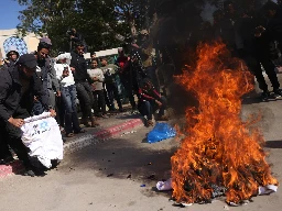 Palestinians burn ‘humiliating’ shirts after release from Israeli prisons