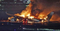 Plane engulfed in flames at Japan airport after collision kills 5