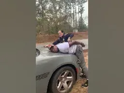 Alabama police officer using stun gun on handcuffed man