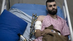 A Palestinian was shot, beaten and tied to an Israeli army jeep. The army says he posed no threat