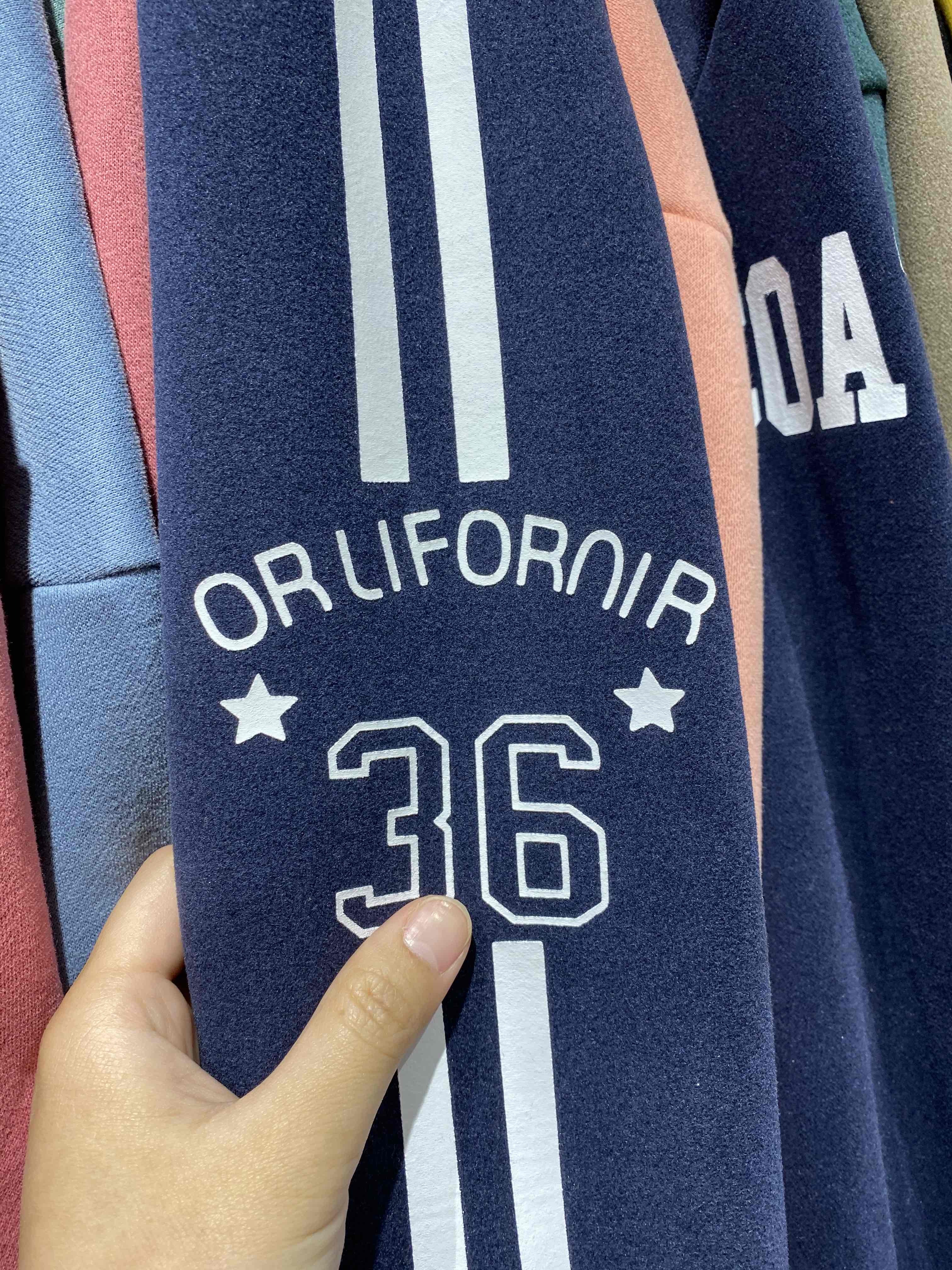 a shirt with "orlifornir" printed on it. its clearly meant to say "california"