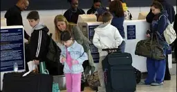 U.S. proposes ban on airline fees for seating parents next to kids