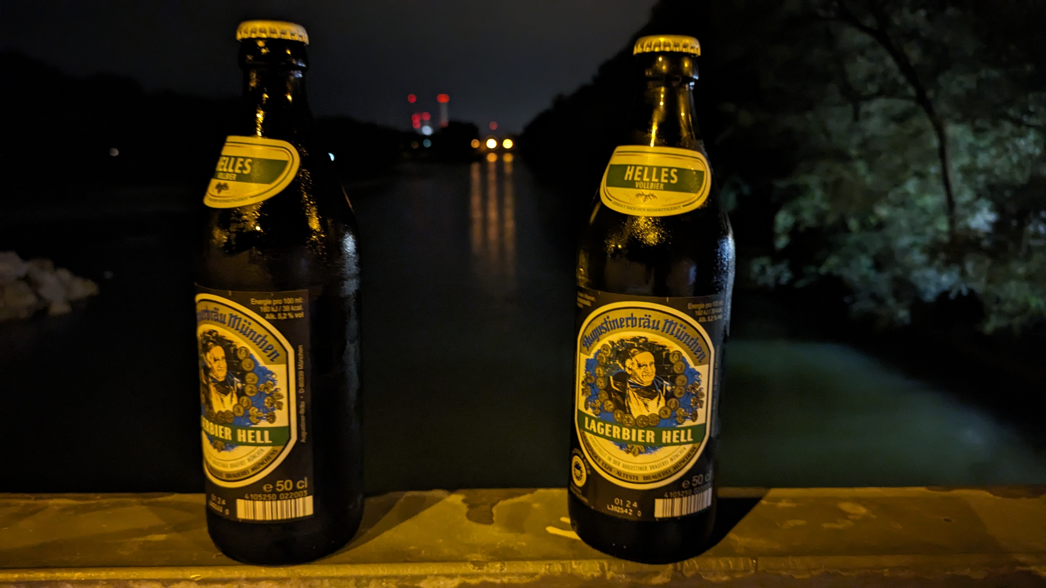 Photo of two beer bottles at Isar river
