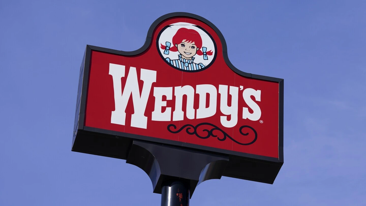 Wendy's says it has no plans to raise prices during the busiest times at its restaurants