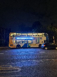 Busses with LED advertising on the side.