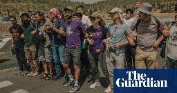 ‘Solidarity over hatred’: the small band of Israelis stopping settlers obstructing aid trucks