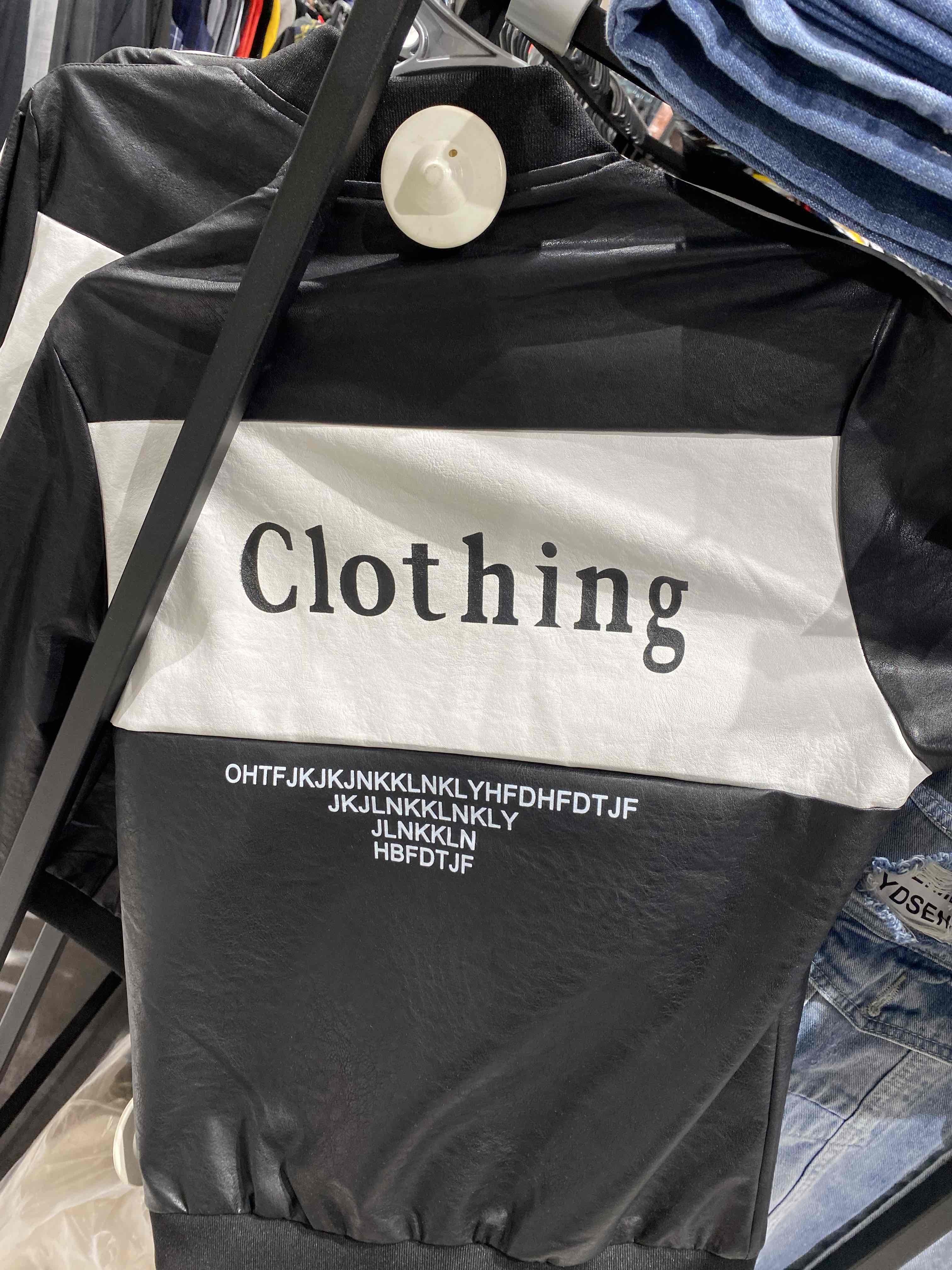 a shirt with text on it. the text says "clothing" then a bunch of random letters.