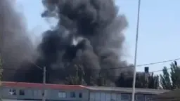 Workshop in Berdiansk where Russians bring military equipment on fire