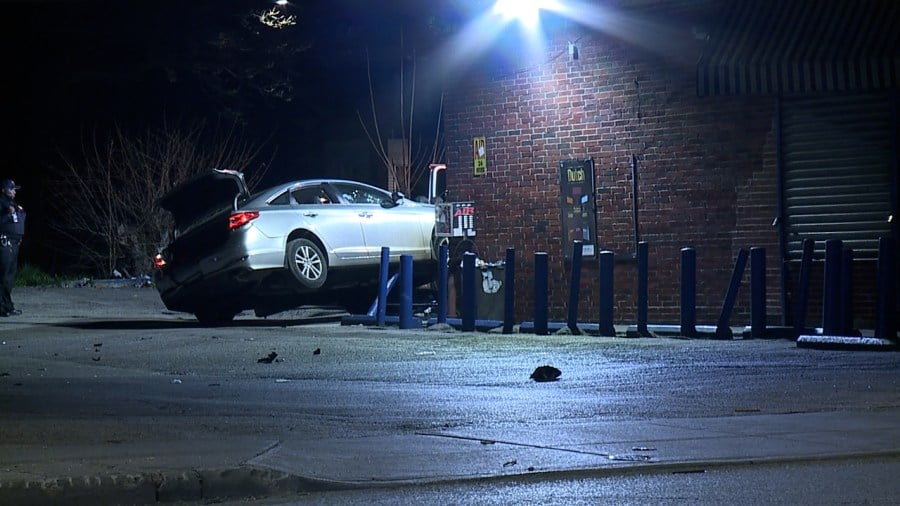 Car stuck on top of parking bollard: How it got there