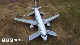 Russian airliner forced to land in open field