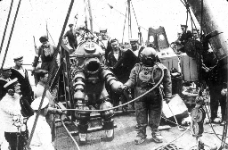 Early atmospheric diving suit preparing to explore the sunken ship Lusitania, ~1935 AD