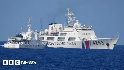 Philippines says China fired water cannon at boats - BBC News