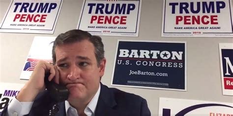 Ted Cruz tearing up while working a phone with Trump/Pence signage on the wall.