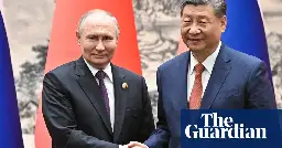 Putin and Xi announce plans to strengthen military ties in Beijing