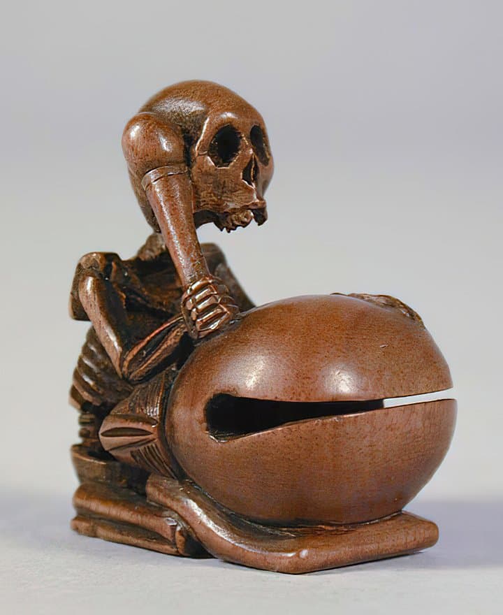 Skeleton playing a 'Wood Fish', a traditional Buddhist music instrument, sculpture made of wood, Japan, 19th century AD